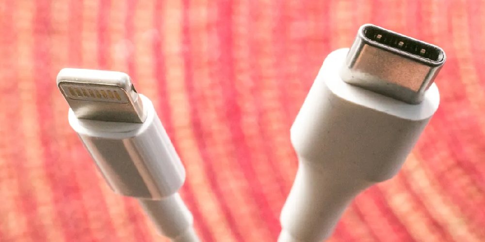 A USB Type-C charger (right) beside Apple's proprietary Lightning cable